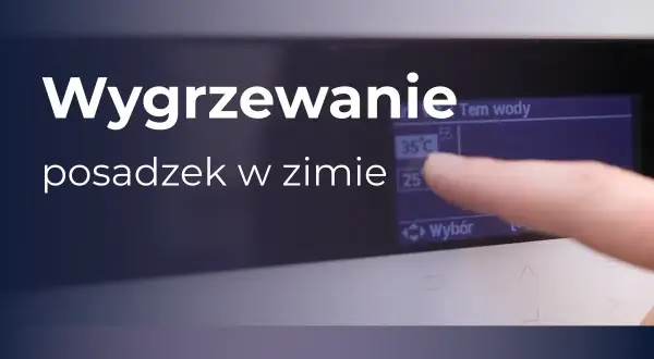 Wygrzewanie posadzek w zimie. Palec dotyka ekranu, ustawiając temperaturę wody na 35°C.